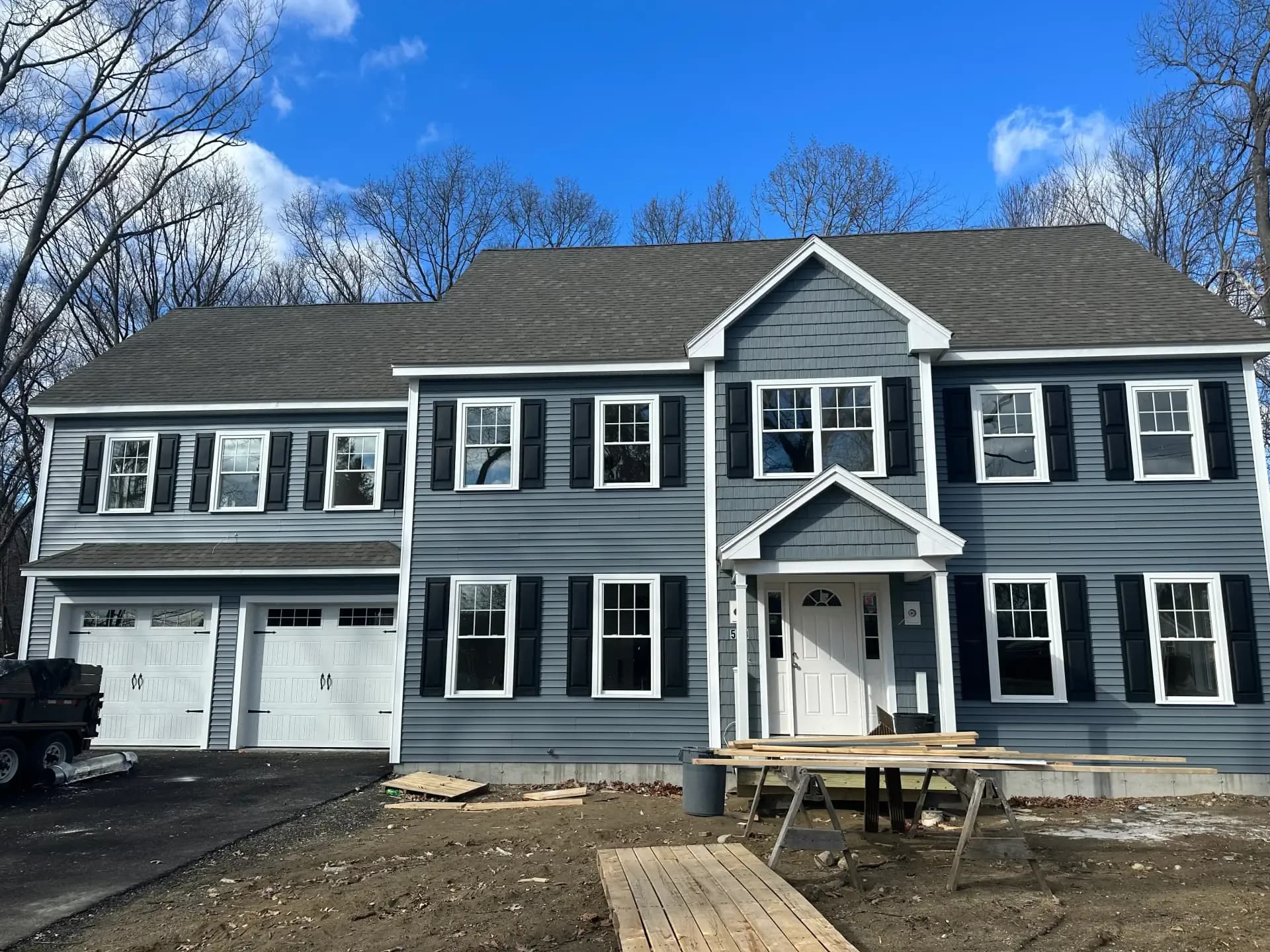 Beautifully renovated home exterior with new siding by FBS Construction in Massachusetts